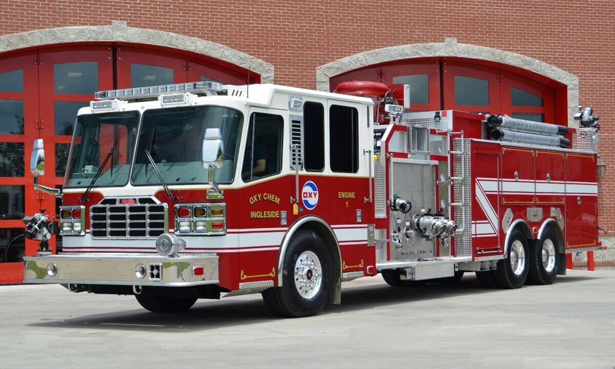 Pumper tankers with pump-and-roll auxiliary pump and bumper turret